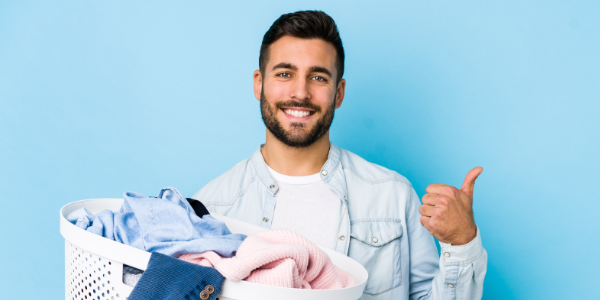 Man Happy About The Laundry Promo On A Blue Background